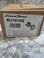Cardboard box with American Standard branding and product code on a marble surface