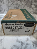 Cardboard box with American Standard branding on a marble surface