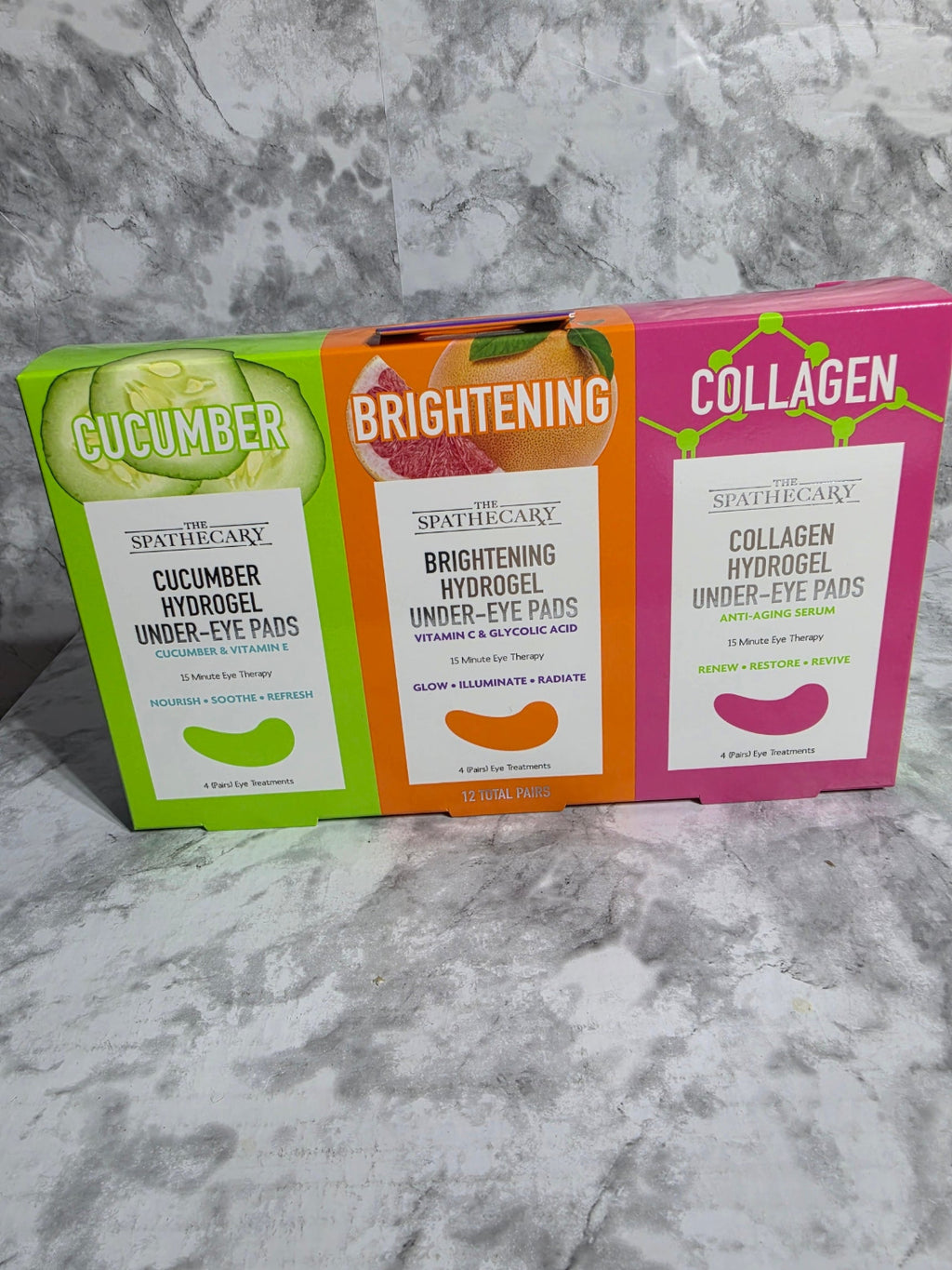 Collagen eye pad packaging on a marble surface