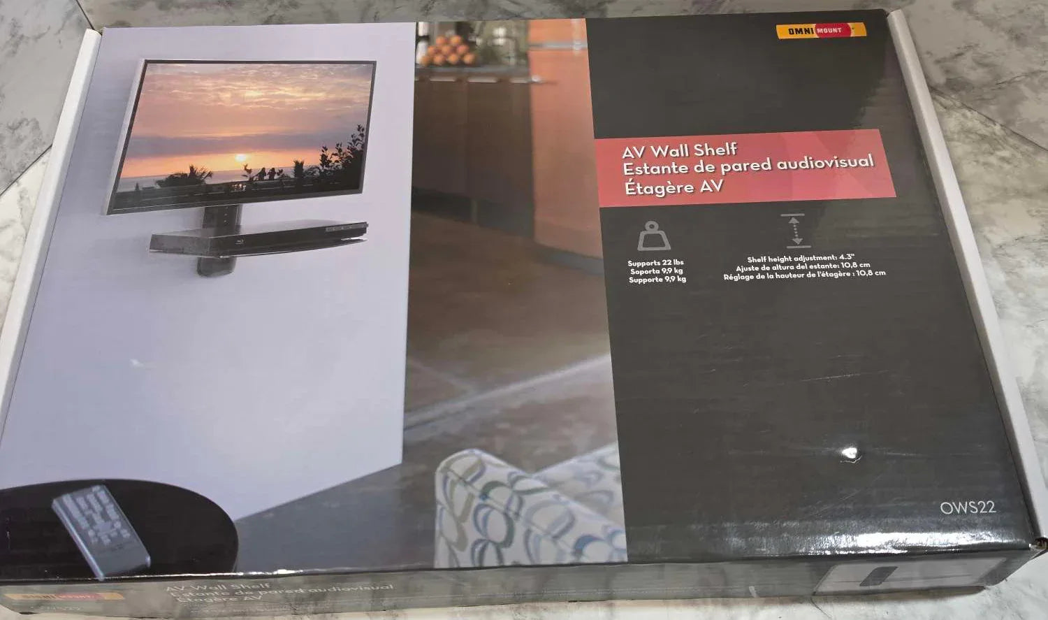 Two books on a marble surface with a sunset scene and text visible