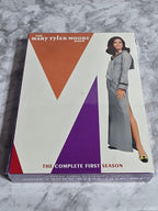DVD box set for 'Mary Tyler Moore' with a geometric design on a gray marble background