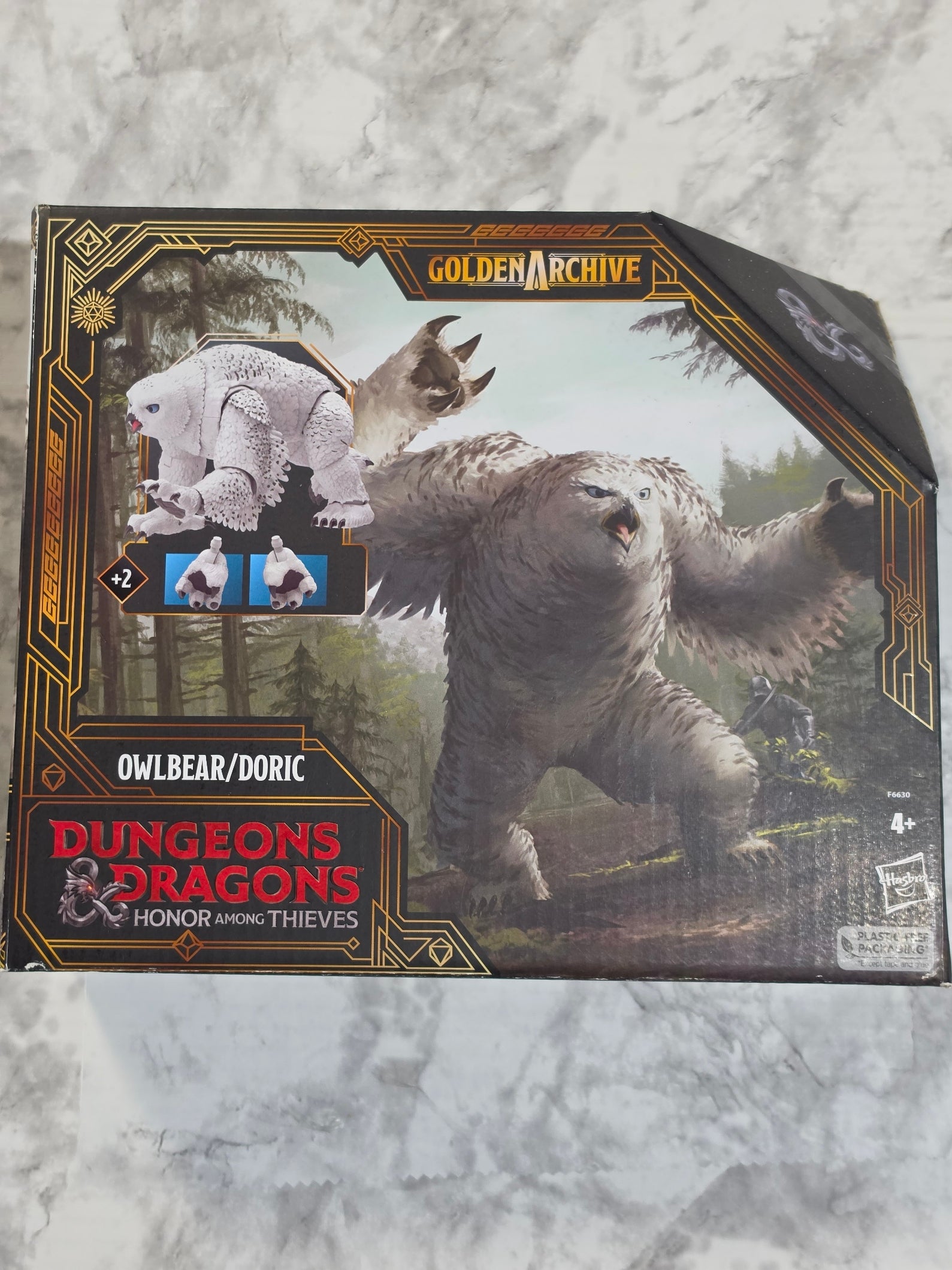 Dungeons & Dragons box with owl bear dndr design on a textured gray background