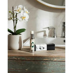 Vixen Botanical Eye Cream dispenser and carton on a wooden bathroom counter