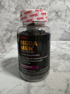 GNC Mega Men supplement bottle on a marble surface
