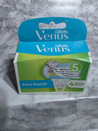 Gillette Venus packaging on a gray marble surface