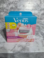 Gillette Venus razor packaging on a marble surface