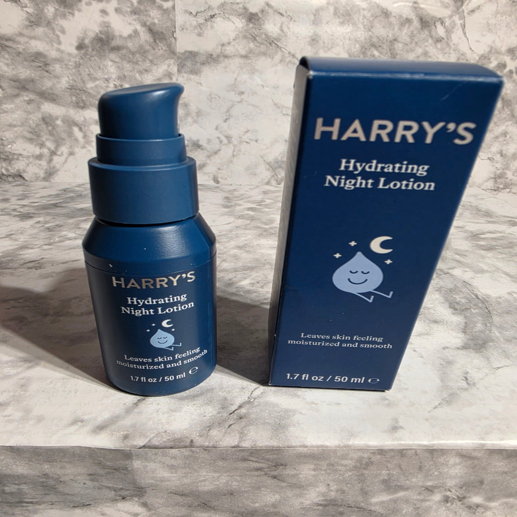 Harry's hydrating night lotion bottle and packaging on a marble surface