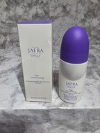 JAFRA DAILY hair care product bottle and packaging on a marble surface
