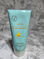 Jafra Tender Moments baby lotion bottle on a gray textured background