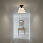 AI-generated lifestyle illustration: Avec Avery matte black and white metal-shade semi-flush light in a hallway; bulb and room furnishings not included.