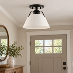 AI-generated lifestyle illustration: Avec Avery matte black and white metal-shade ceiling light in a home foyer; bulb and room furnishings not included.
