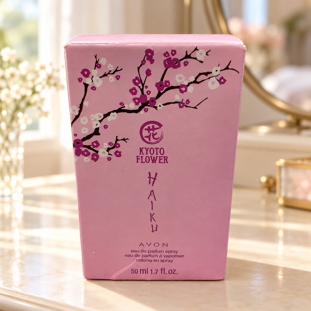AI-generated lifestyle illustration: closed Avon Haiku Kyoto Flower 50 mL / 1.7 fl oz carton with visible creases on a vanity; furnishings and decorative props not included.