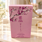 AI-generated lifestyle illustration: closed Avon Haiku Kyoto Flower 50 mL / 1.7 fl oz carton with visible creases on a vanity; furnishings and decorative props not included.