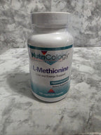 Nutricology L-Methionine supplement bottle on a marble surface