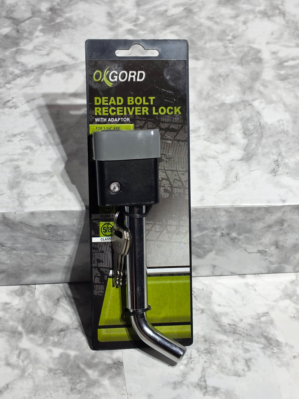OXGORD dead bolt handle lock on a gray marble surface