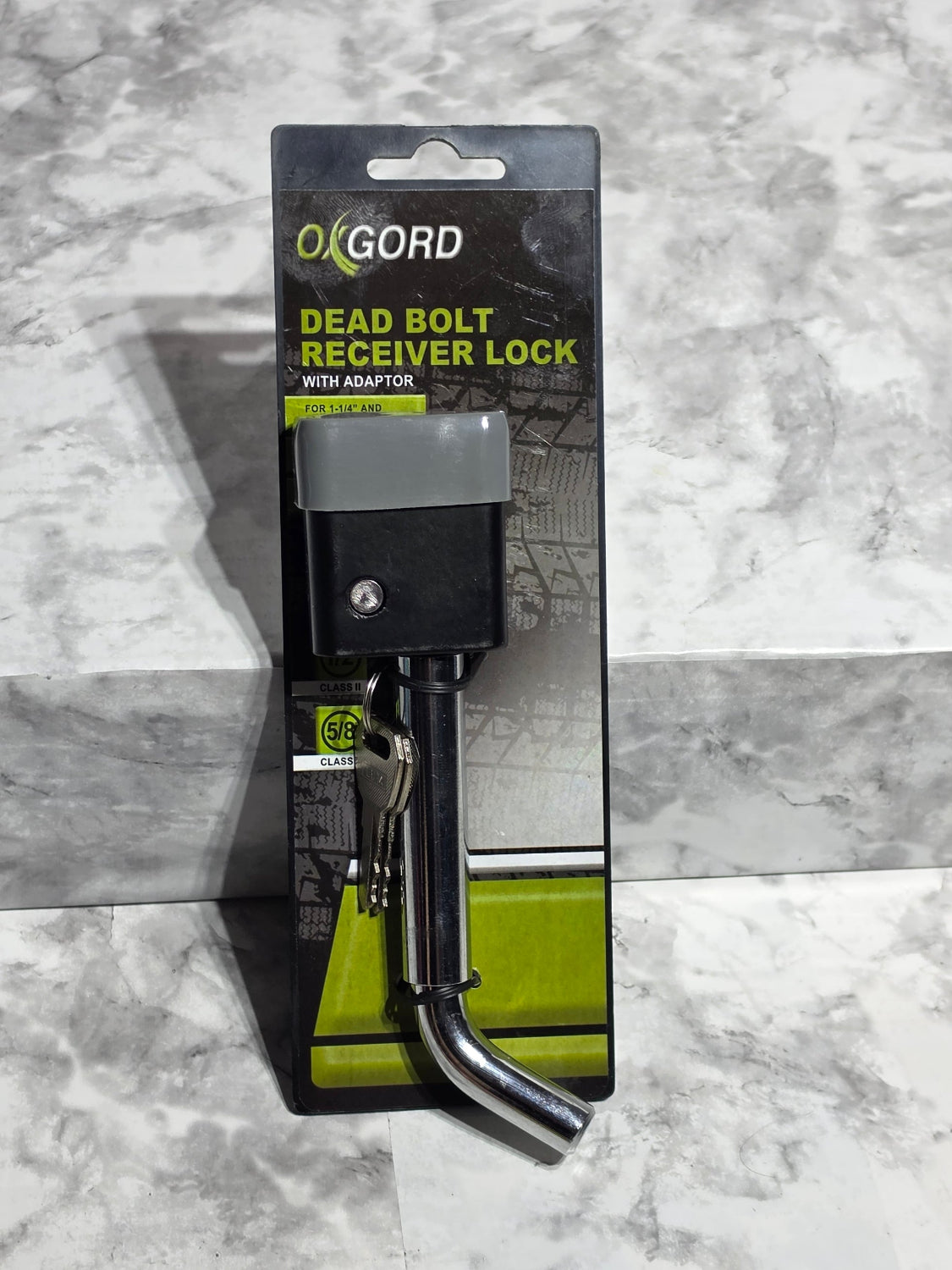 OXGORD dead bolt handle lock on a gray marble surface