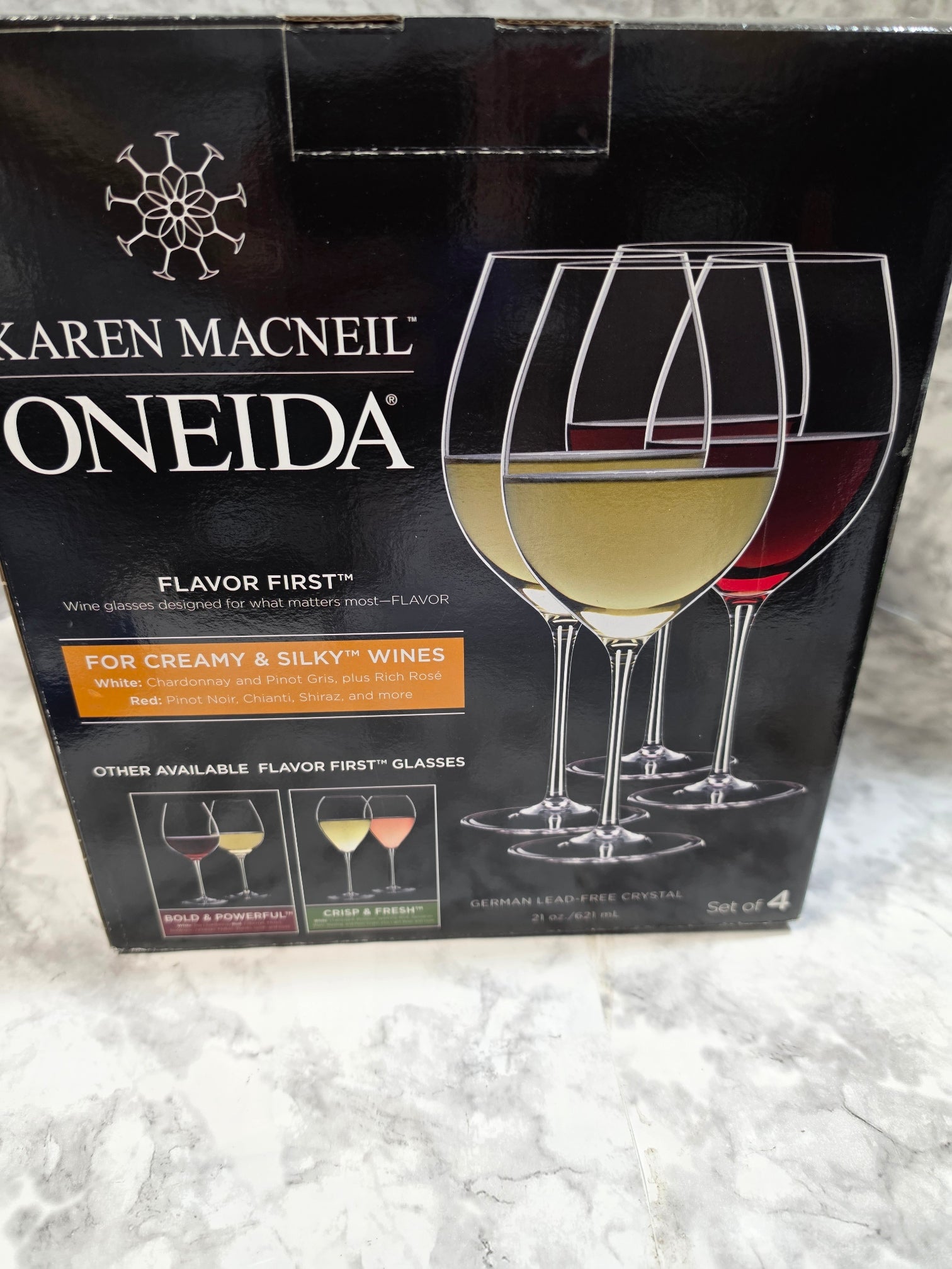 Oneida wine glass packaging on a textured surface