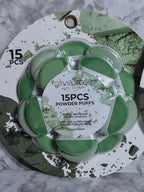 Pack of Olivia Rose powder puffs on a decorative tray with green and white design.