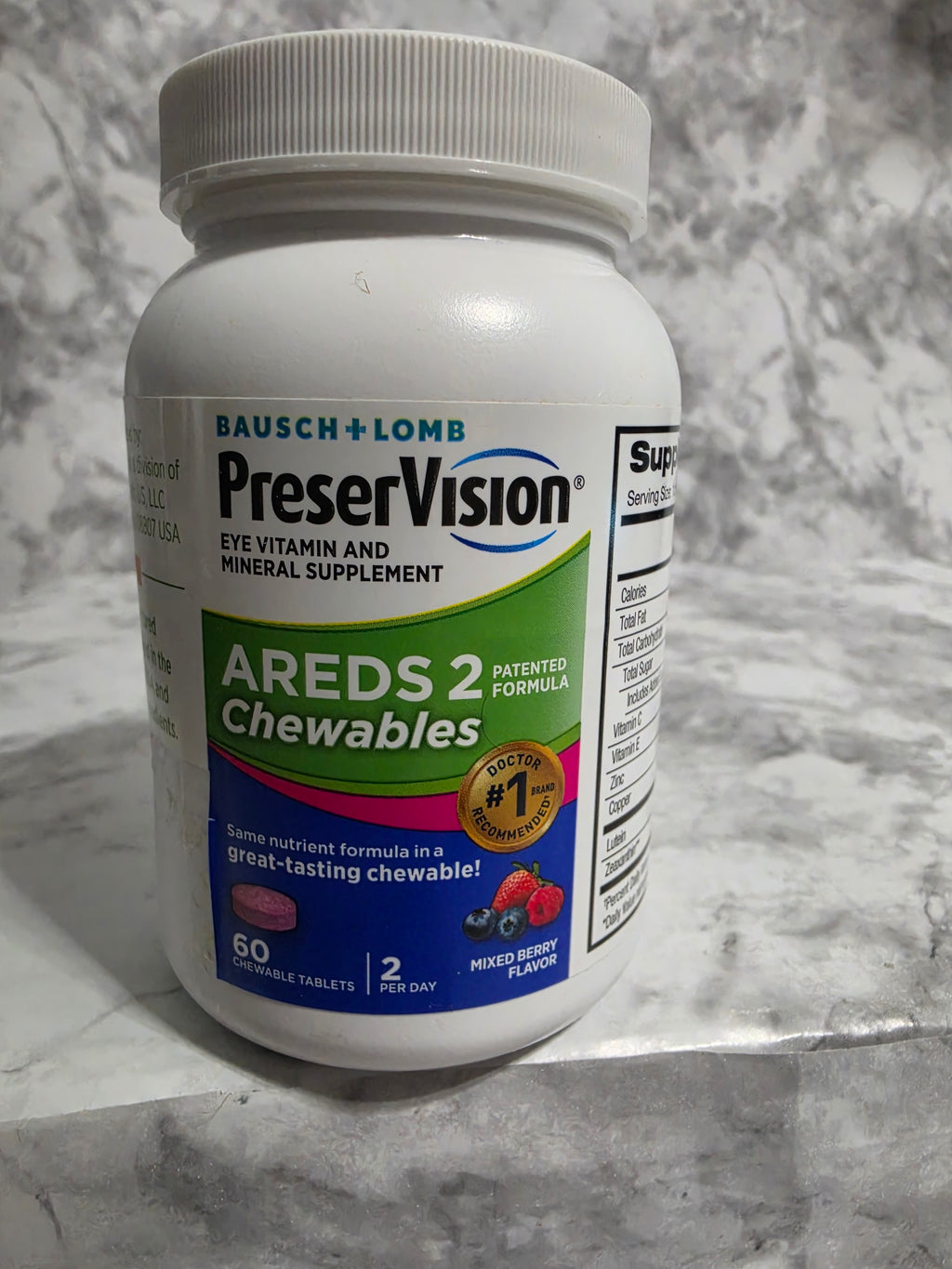 PreserVision AREDS 2 Chewables bottle on a marble surface