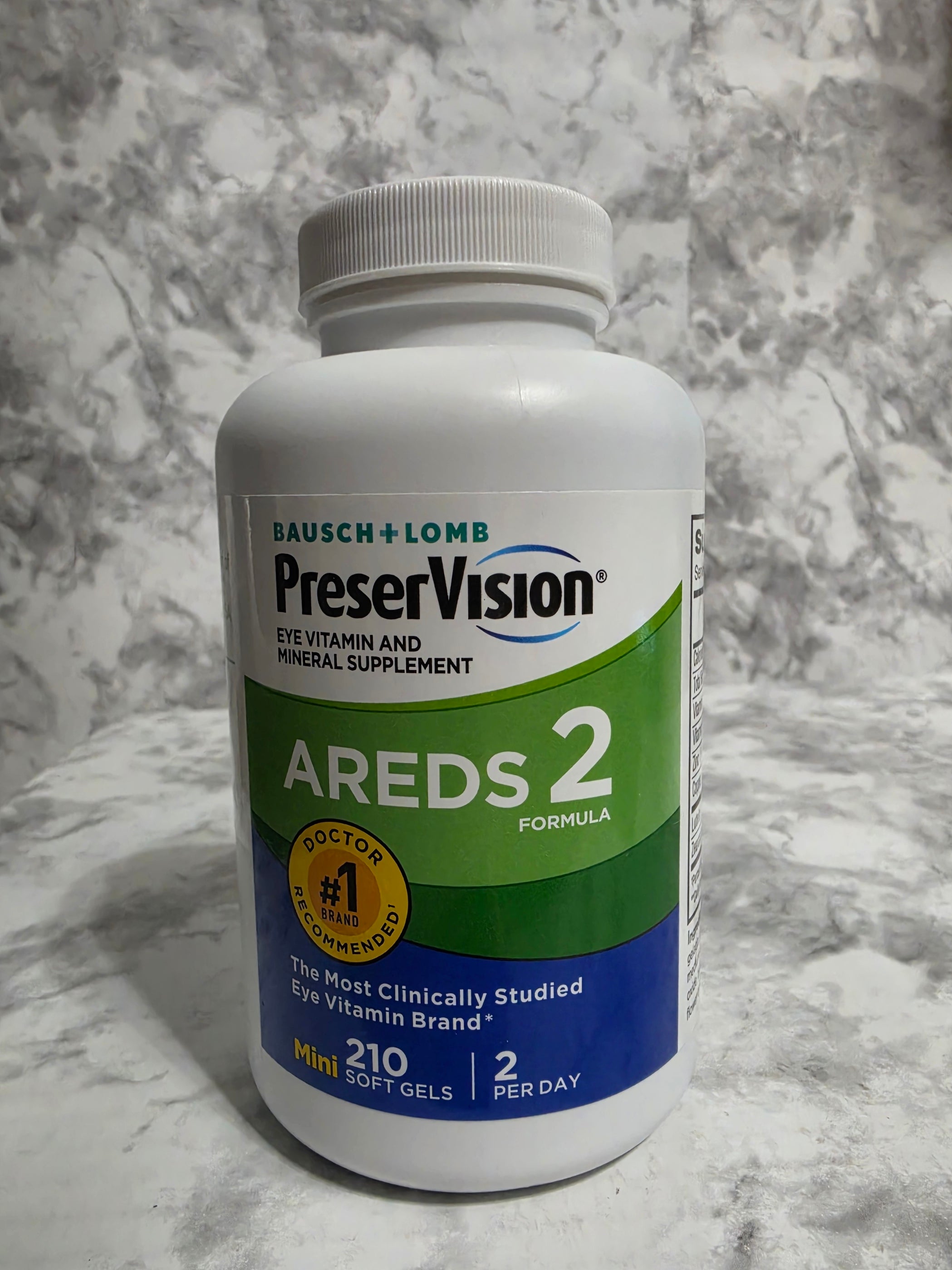 PreserVision AREDS 2 supplement bottle on a marble surface