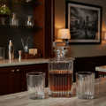 Professional home bar featuring an elegant Godinger Ludlow crystal decanter filled with bourbon