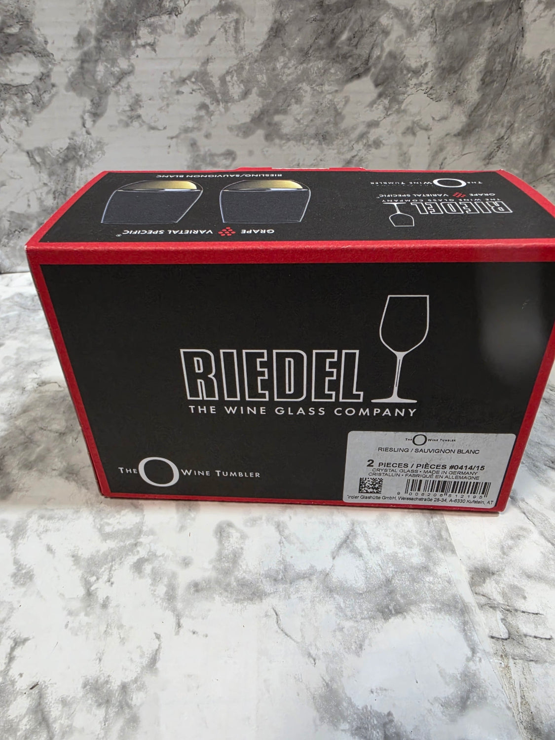 Riedel wine glass packaging on a marble surface