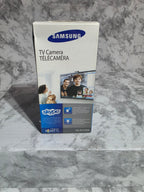 Samsung TV camera packaging on a marble surface