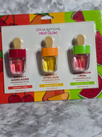 Spacriptions Fruit Glow lip oil set on a colorful box with fruit illustrations.
