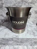 Stainless steel champagne bucket with Houdini branding on a marble surface