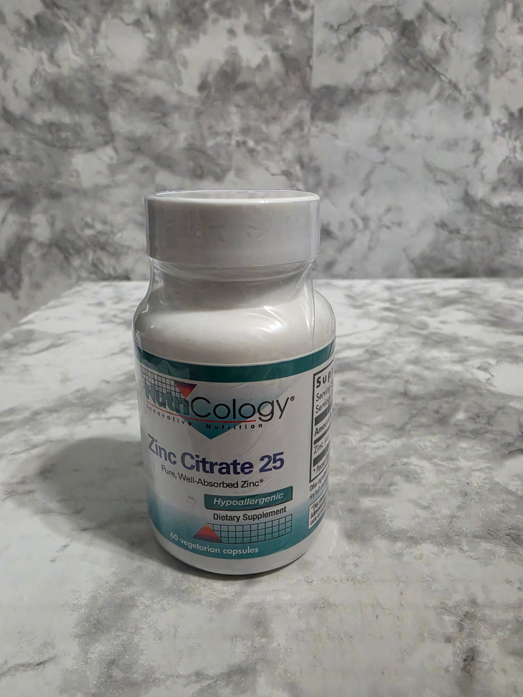 Supplement bottle labeled 'Cologyn' on a marble surface