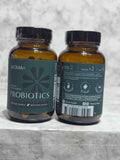 Actual stock photo of teal-label BIOMA Probiotics showing front and rear label designs on two bottles; each purchase includes one 60-capsule bottle.