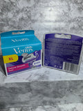Two packages of Gillette Venus razors on a gray marble surface