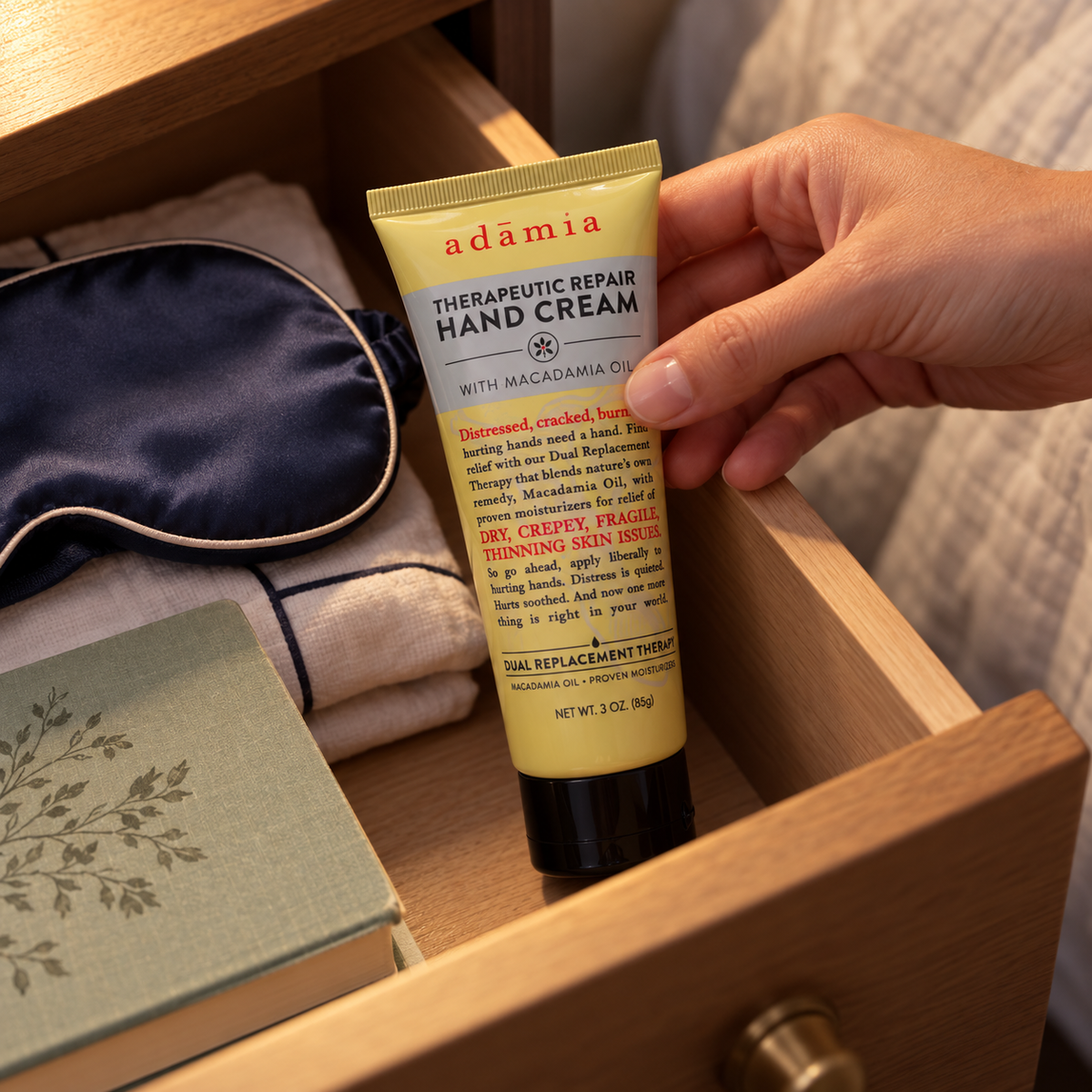 AI illustration of Adamia 3 oz yellow hand cream tube being placed in a bedside drawer; props not included