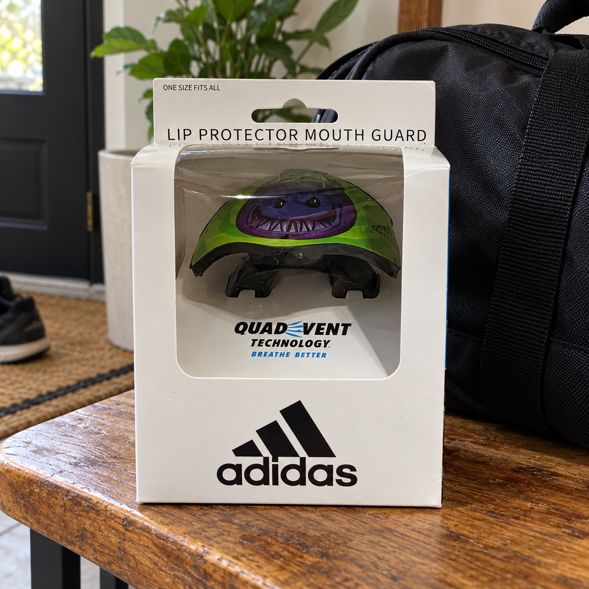 AI-styled Adidas Big Mood Demon AD-LP-910 mouthguard in original packaging at a entryway
