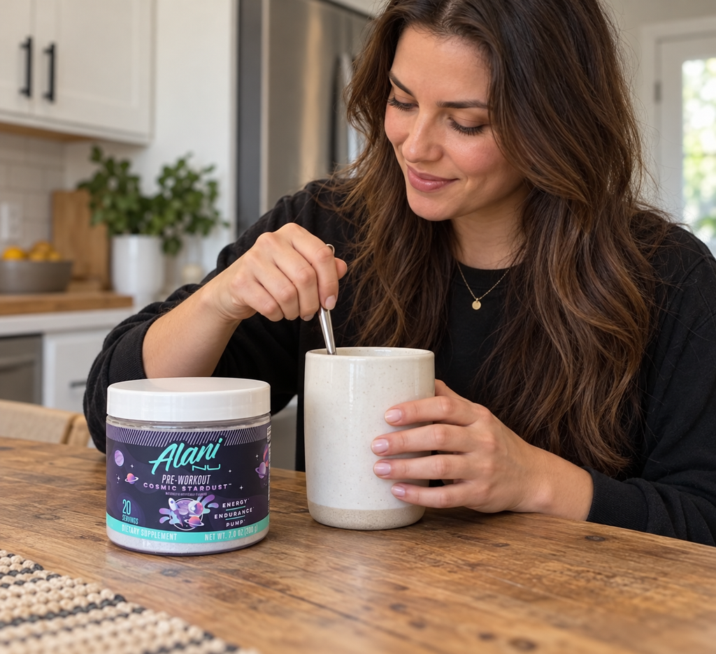 AI-assisted illustration: Stirring a drink beside Alani Nu Cosmic Stardust pre-workout.