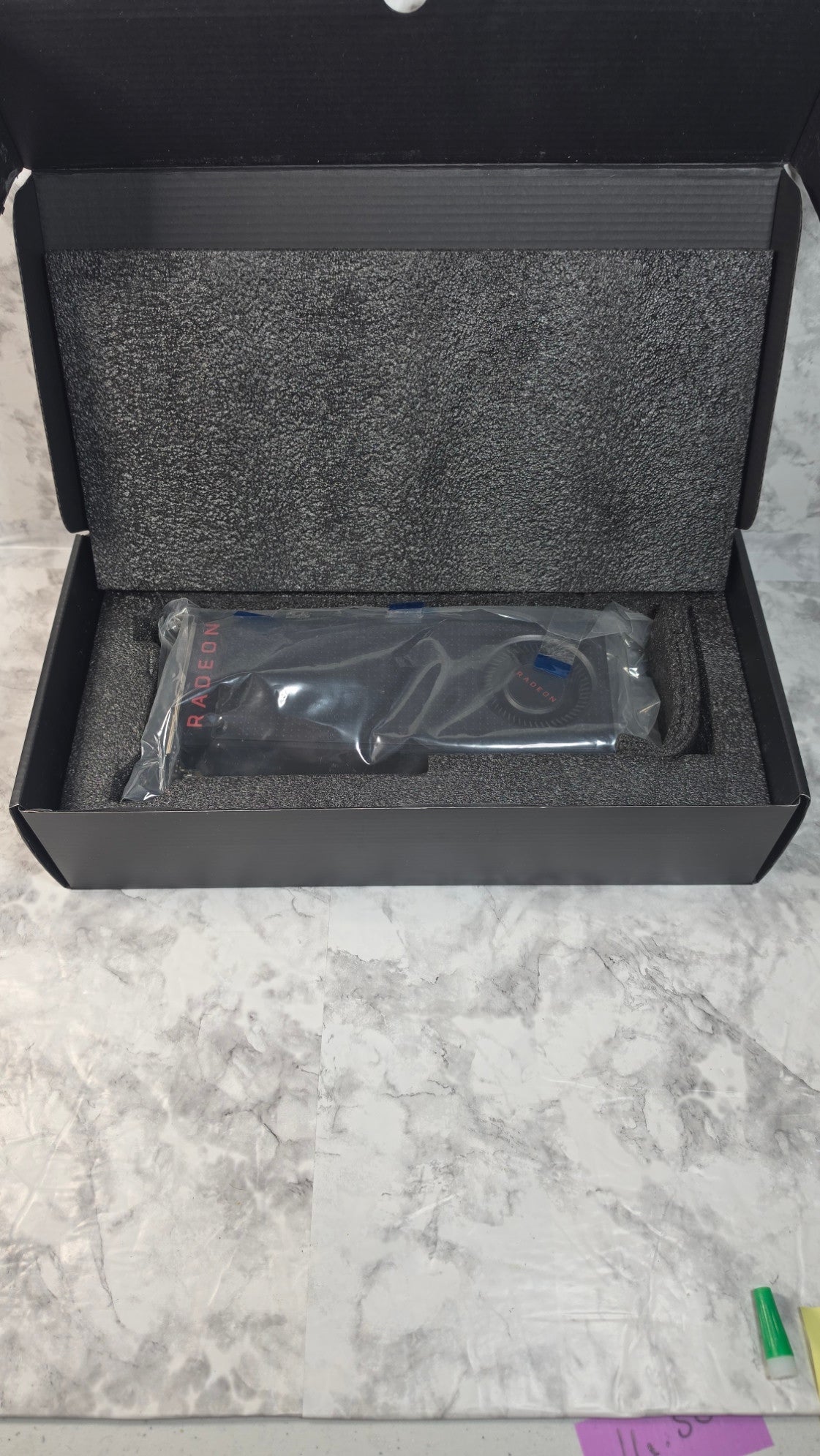 Radeon RX 480 graphics card in its protective bag and open foam-lined box