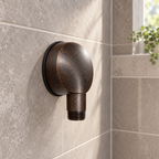 AI-generated context: American Standard8888037.224 bronze wall elbow on warm gray shower tile