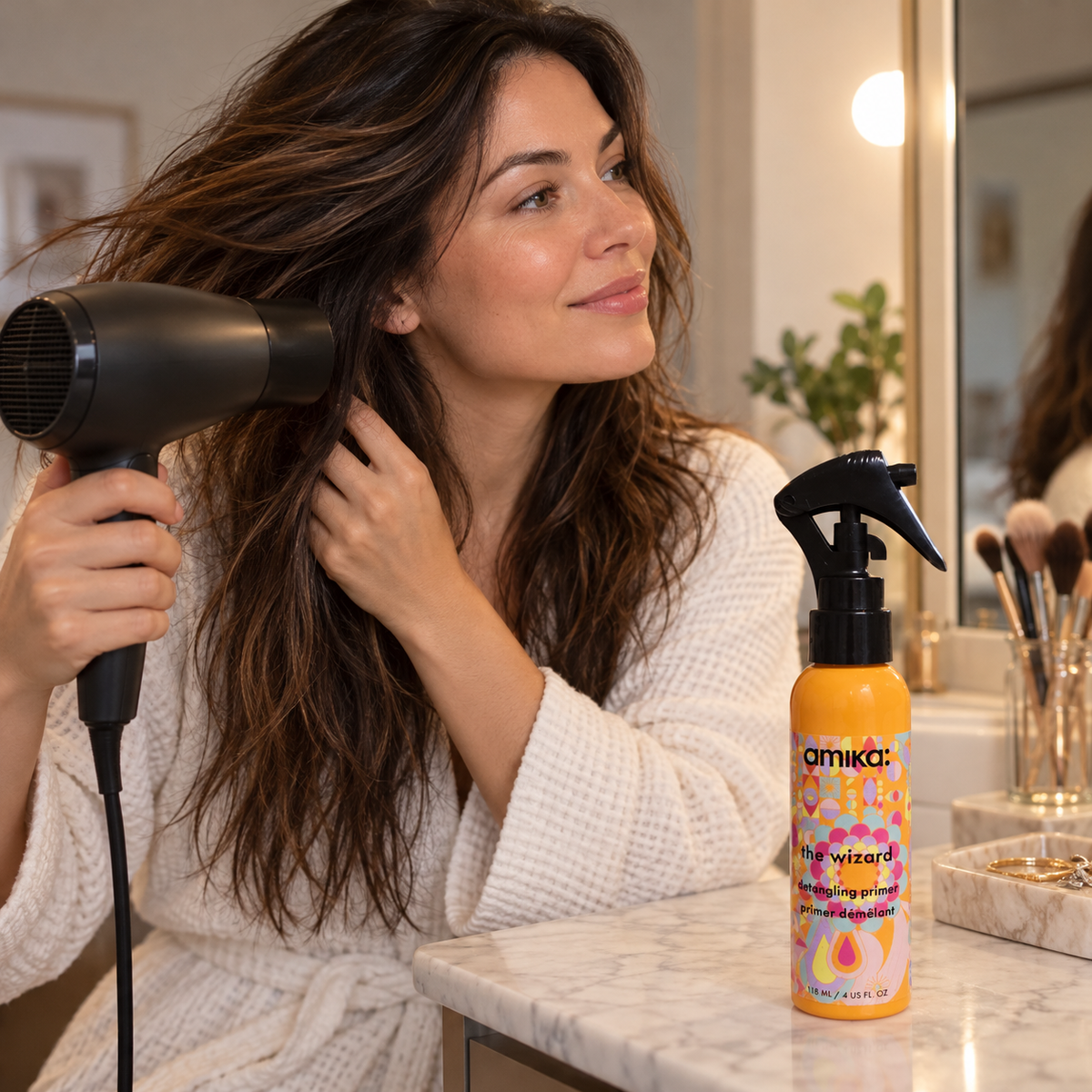 AI-generated context: adult blow-drying hair after using amika The Wizard 118 mL primer; dryer not included