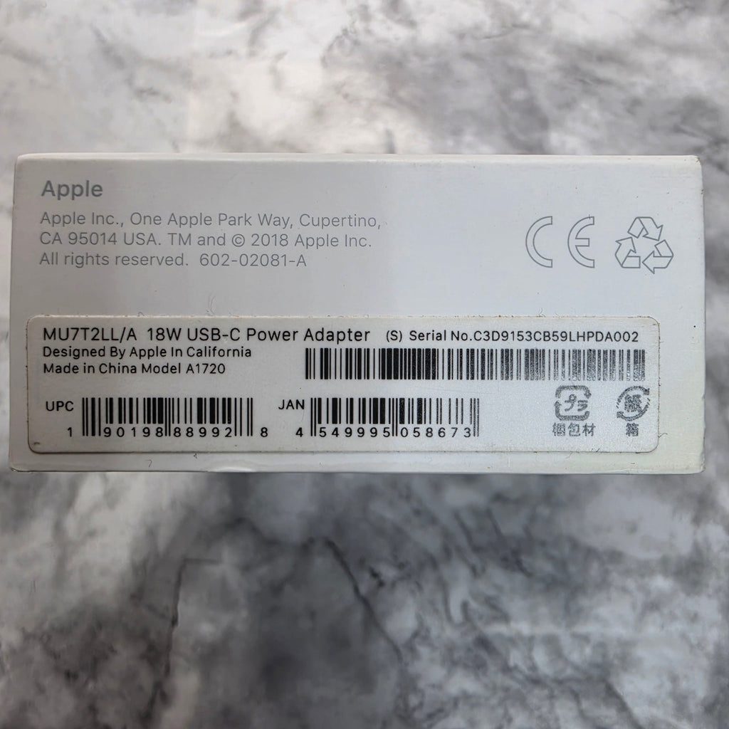 Apple 18W USB-C Power Adapter MU7T2LL/A Model A1720 package label showing UPC 190198889928, JAN 4549995058673 and Made in China