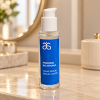 AI-generated illustration of Arbonne Bio-Hydria serum on a warm-lit vanity; props not included