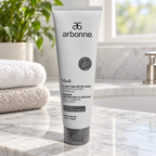AI-generated illustration of Arbonne Clarifying Detox Mask on a bathroom vanity beside towels; props not included