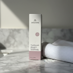 AI-generated contextual image of Arbonne TrueSmooth Apple Vinegar Hair Rinse 5 fl oz boxed product beside a folded towel