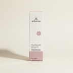 AI-generated contextual image of Arbonne TrueSmooth Apple Vinegar Hair Rinse 5 fl oz boxed product on a neutral studio background