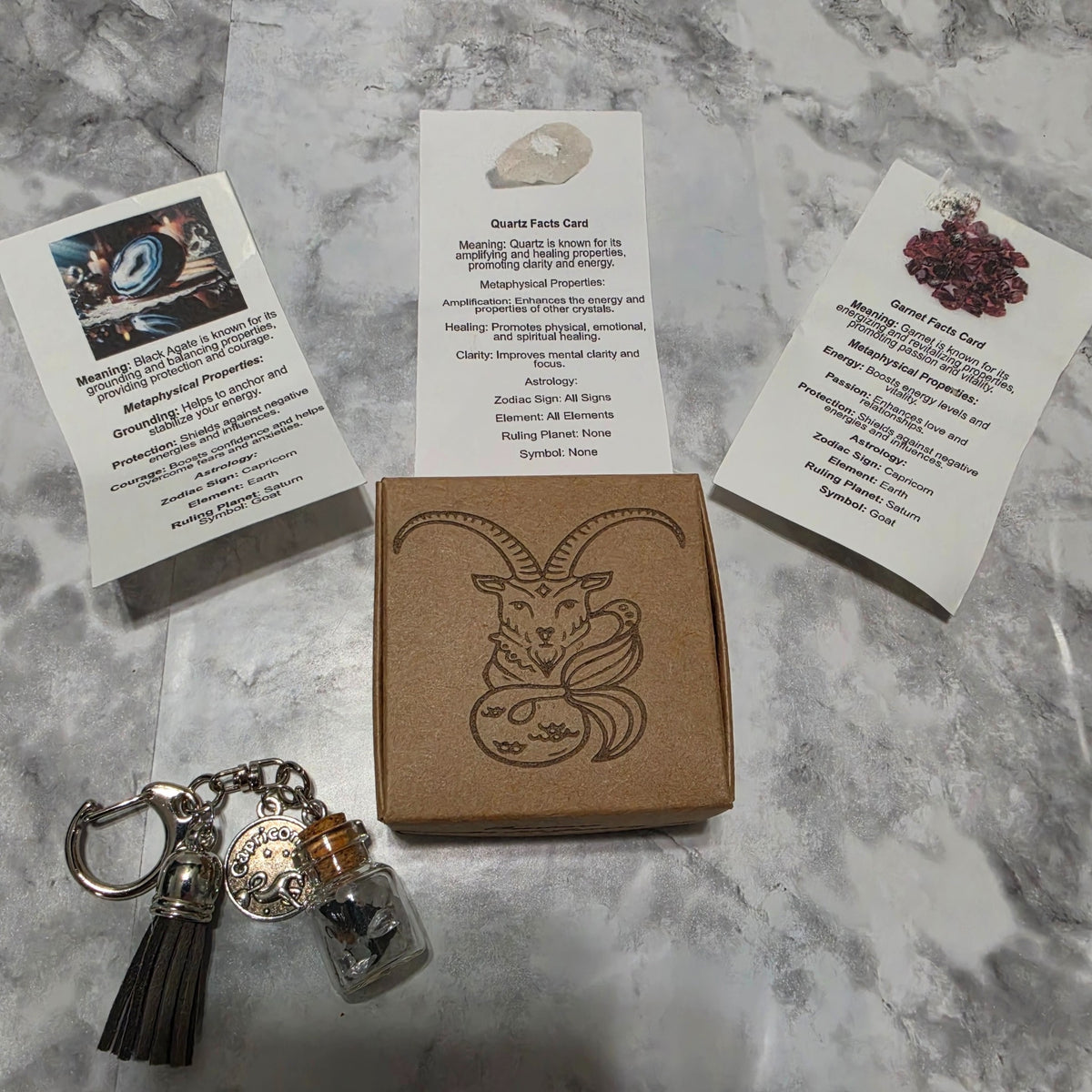 Capricorn example: handmade crystal bottle keychain, engraved zodiac gift box and matching cards