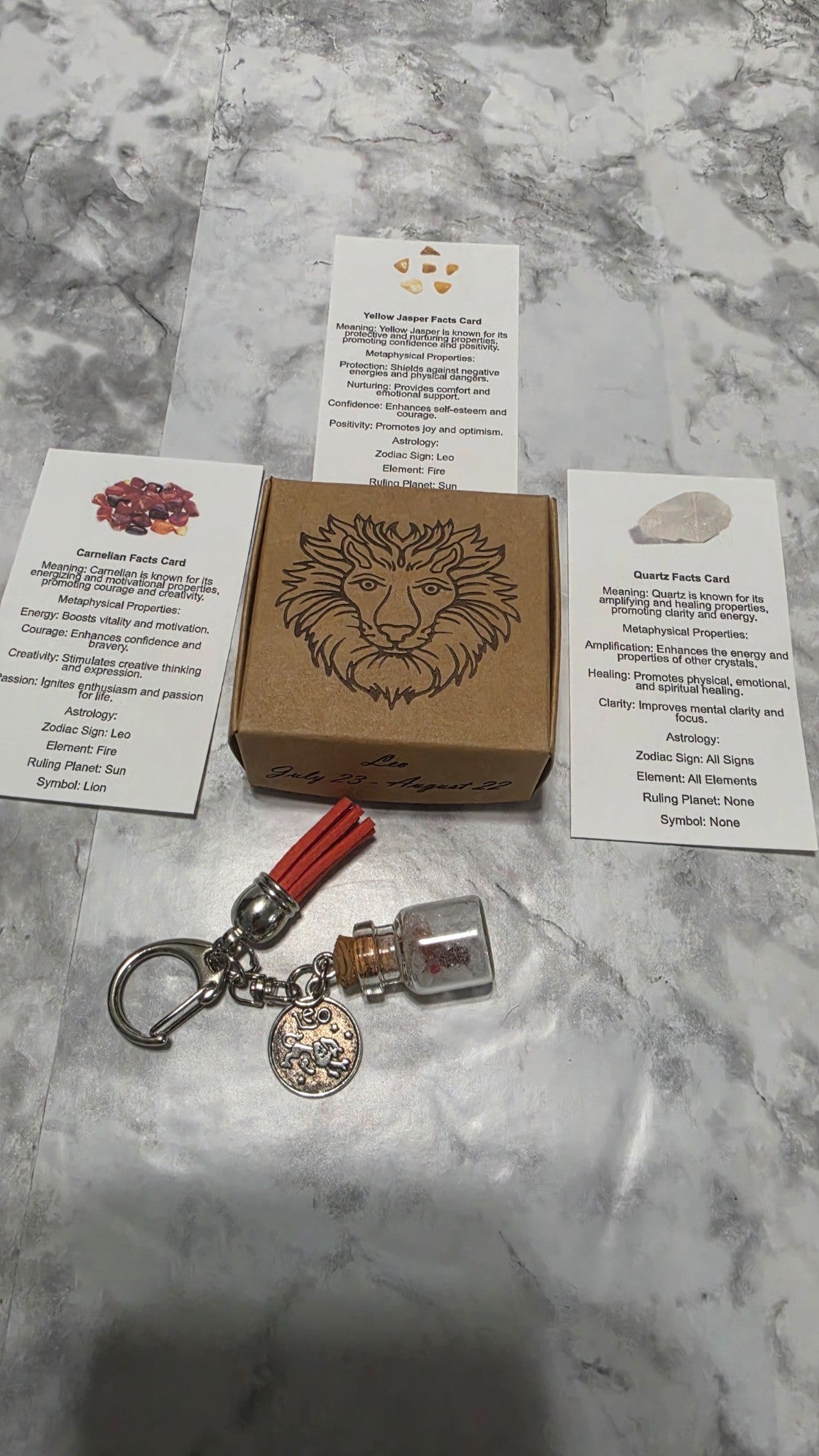 Leo handmade crystal bottle keychain with orange-red tassel, engraved lion gift box and three printed crystal cards
