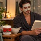 Man reading during a clay-mask routine with an Aztec Secret jar nearby