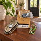 AI lifestyle illustration: Baldwin Arch polished nickel doorbell kit with bracket, bagged fasteners and box on an entry console