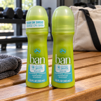 AI-generated lifestyle scene of two capped Ban Purely Gentle roll-on bottles on a home gym bench; props not included