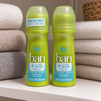 AI-generated lifestyle scene of two capped Ban Purely Gentle roll-on bottles on a linen shelf; towels not included