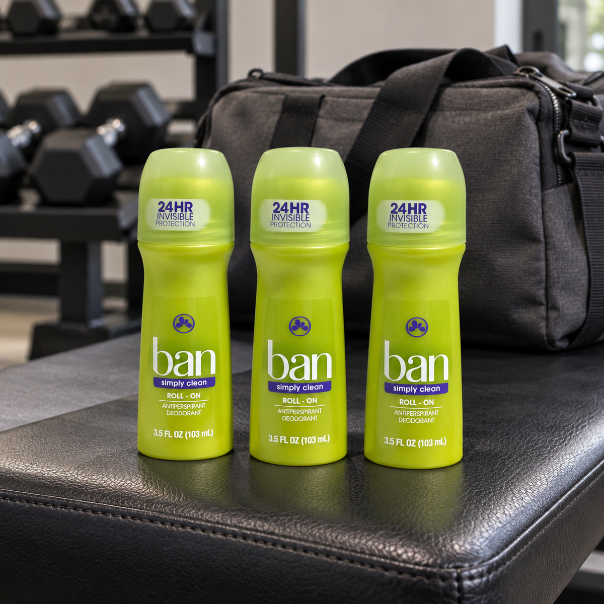 AI-generated lifestyle scene of three capped Ban Simply Clean 3.5 fl oz roll-on bottles on a home gym bench; props not included